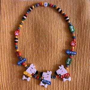 Wooden dog necklace.